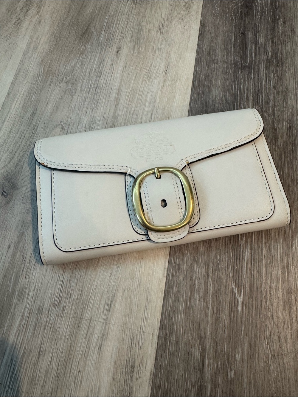 NEW Coach Bleecker leather wallet featuring a distinct brass buckle closure